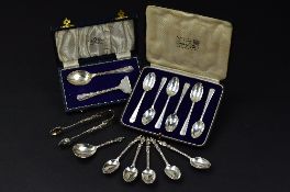 A SET OF FIVE LATE VICTORIAN APOSTLE TOP SILVER TEASPOONS, with matching sugar tongs (repair) and