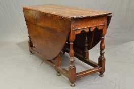 AN 18TH CENTURY AND LATER OAK OVAL GATE LEG TABLE, fitted with a single end drawer with a turned