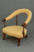 A VICTORIAN WALNUT FRAMED TUB CHAIR, the rounded upholstered back with scrolled terminals