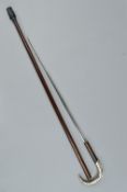A LATE 19TH CENTURY SWORD STICK, the white metal crook handle repousse decorated with a Stag