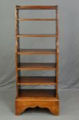 A 19TH CENTURY MAHOGANY WATERFALL BOOKCASE, with four adjustable sliding shelves and one fixed