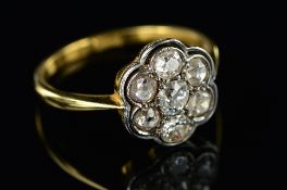 AN EARLY 20TH CENTURY DIAMOND ROUND CLUSTER RING, seven old European cut diamonds measuring on