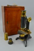 A LATE VICTORIAN WALNUT CASED MICROSCOPE, un-named, fitted with drawer of glass slides and various