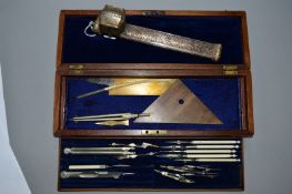 A LATE VICTORIAN MAHOGANY CASED SET OF DRAWING INSTRUMENTS, bears engraved brass name plaque to