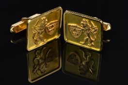 A PAIR OF CUFFLINKS, square shape with an applied lion and shield motif, hinged fitting, stamped '