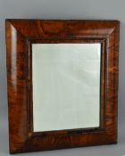 A WILLIAM & MARY AND LATER WALNUT VENEERED CUSHION FRAMED MIRROR, later bevel edged plate, plate