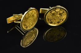 A PAIR OF CUFFLINKS, holding an Austrian Ducat coin each, dated 1915, hinged fitting, approximate