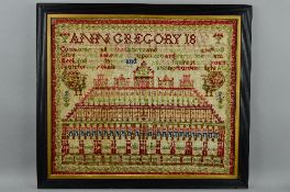 AN EARLY 19TH CENTURY NEEDLEWORK SAMPLER, wool on a coarse linen ground, with text, peacocks,
