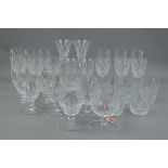 A PART SUITE OF TWENTY FIVE WATERFORD CRYSTAL DRINKING GLASSES, oval facet and hobnail cut