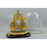 A 19TH CENTURY GILT METAL AND PORCELAIN MOUNTED MANTEL CLOCK, urn surmount above an oval painted