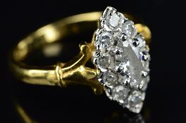 A LATE 20TH CENTURY DIAMOND MARQUISE SHAPE CLUSTER RING, centring on a marquise cut diamond enclosed