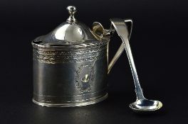 A GEORGE III OVAL SILVER MUSTARD POT, hinged domed cover with ball finial, engraved foliate