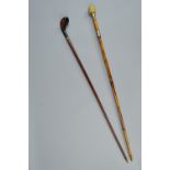 A LATE 19TH CENTURY WALKING CANE WITH GOLF CLUB HANDLE, inlaid decoration, length approximately