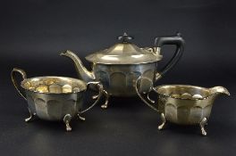 AN ELIZABETH II SILVER THREE PIECE TEA SERVICE, oval panelled form, on cabriole legs with paw