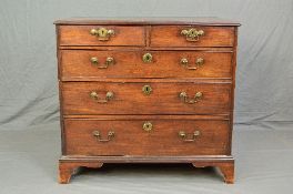 A GEORGE III MAHOGANY CHEST OF TWO SHORT AND THREE LONG GRADUATED DRAWERS, shaped brass