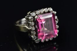 A MODERN PINK TOPAZ AND DIAMOND SQUARE CLUSTER RING, please note the pink topaz has been assessed as