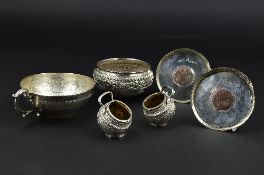 A PAIR OF INDIAN WHITE METAL SALTS, of spherical form, repousse foliate decoration and band and