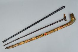 A NOVELTY AFRICAN WALKING STICK, with painted and overlaid bark decoration, the handle in the form
