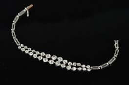 AN EARLY 20TH CENTURY DOUBLE ROW GRADUATED DIAMOND BRACELET, old European cut diamonds spectacle