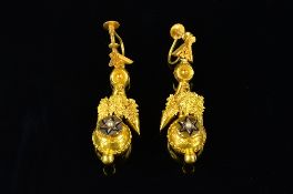 A PAIR OF VICTORIAN GOLD DROP EARRINGS, each comprised of gold repousse foliate design, suspending a