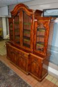 A VICTORIAN MAHOGANY BREAKFRONT BOOKCASE, central section with arched cornice above glazed double