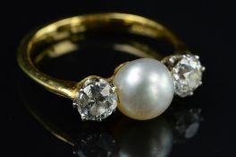 AN 18CT GOLD THREE STONE CULTURED PEARL AND DIAMOND RING, two old European cut diamonds measuring