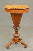 A VICTORIAN WALNUT AND INLAID TRUMPET SHAPED WORK TABLE, of octagonal form, the top inlaid with a