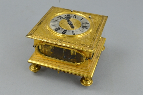 A 17TH CENTURY STYLE GILT METAL HORIZONTAL STRIKING AND REPEATING TABLE CLOCK, of square form,