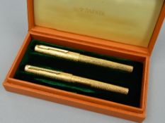A PARKER 105 FOUNTAIN PEN AND BALL PEN SET, rolled gold bark effect, the ball pen with plastic label