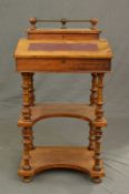 A VICTORIAN WALNUT DAVENPORT, the brass and walnut gallery over a hinged lid opening to reveal an