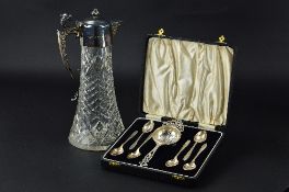 AN ELIZABETH II SILVER MOUNTED GLASS CLARET JUG, of conical form, mask spout, beast head