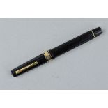 AN OMAS 557-F FOUNTAIN PEN, in black and gold, stamped Omas 557-F, with 1922 along the same facet,