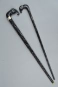 A LATE VICTORIAN CARVED EBONY WALKING CANE WITH ELEPHANT HANDLE, inlaid eyes, ivory tusks broken,
