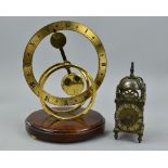A MODERN BRASS MANTEL CLOCK WITH MYSTERY COUNTER BALANCE MOVEMENT, circular open form, Roman