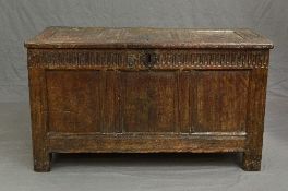 AN 18TH CENTURY OAK COFFER, triple panel hinged top, the interior with left hand end shelf, the