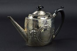 A GEORGE III OVAL SILVER TEAPOT, later foliate embossed decoration and contemporary bright cut