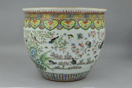 A CHINESE FAMILLE VERTE FISH BOWL, depicting birds and butterflies amongst foliage, diameter 36cm