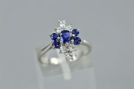 A LATE 20TH CENTURY 18CT WHITE GOLD DIAMOND AND SAPPHIRE DRESS RING, a up finger marquise cluster
