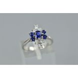 A LATE 20TH CENTURY 18CT WHITE GOLD DIAMOND AND SAPPHIRE DRESS RING, a up finger marquise cluster