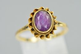 A LATE 20TH CENTURY 9CT GOLD SINGLE STONE AMETHYST RING, oval amethyst measuring approximately 9mm x