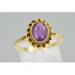 A LATE 20TH CENTURY 9CT GOLD SINGLE STONE AMETHYST RING, oval amethyst measuring approximately 9mm x