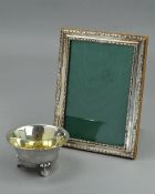 A SILVER FRAME, and a silver dish (2)