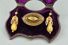 A VICTORIAN SUITE OF YELLOW METAL JEWELLERY, including a brooch and a pair of earrings
