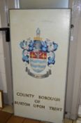 A PAINTED WOODEN COUNTY BOROUGH OF BURTON UPON TRENT SIGN, fitted for wall hanging, approximate size