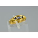 AN EARLY 20TH CENTURY SAPPHIRE AND DIAMOND GYPSY STYLE HALF HOOP RING, estimated total diamond