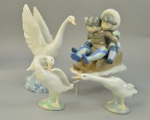 A LLADRO FIGURE GROUP, 'Hang On' boy and girl on sledge, No5665, together with two Lladro geese