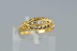 AN EARLY 20TH CENTURY 18CT GOLD DIAMOND HALF HOOP RING, boat setting, pierced gallery and scroll