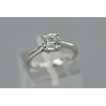 A MODERN 9CT WHITE GOLD DIAMOND SINGLE STONE RING, one brilliant cut diamond illusion set, estimated