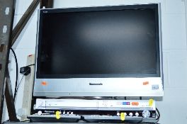 A PANASONIC 23' LCD TV, and a DVD video player (2) (two remotes)