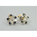 A LATE 20TH CENTURY 9CT WHITE GOLD SAPPHIRE AND DIAMOND ROUND CLUSTER STUD EARRINGS, the single